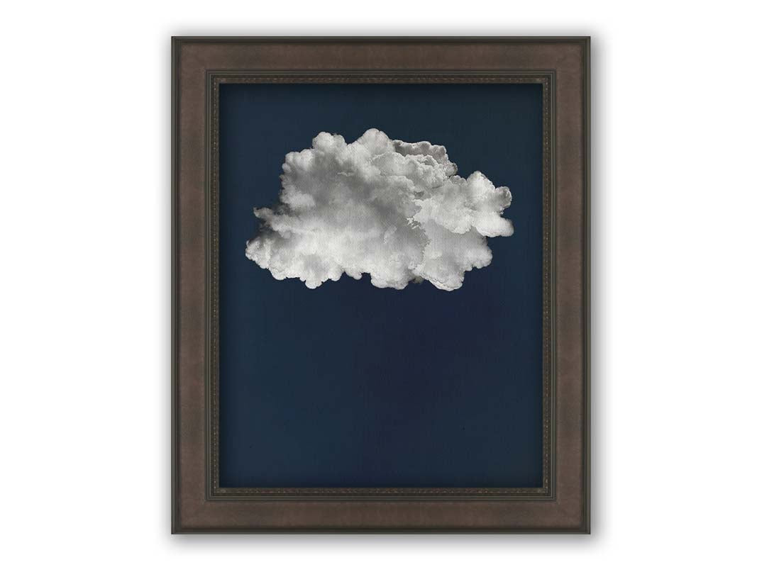 A photo edit of a large, fluffy white cloud against a deep blue background. Printed on canvas and framed.