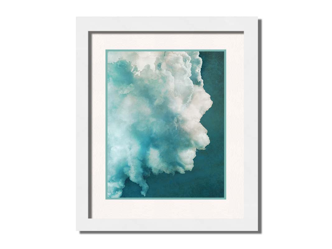 A photograph of a big white cloud with a teal background. Printed on paper, matted, and framed.