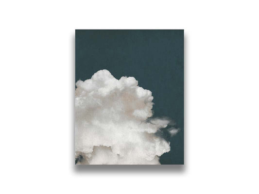 An edited photo of a fluffy white cloud against a deep navy blue background. Printed on canvas.