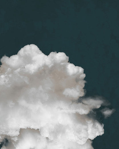 An edited photo of a fluffy white cloud against a deep navy blue background.