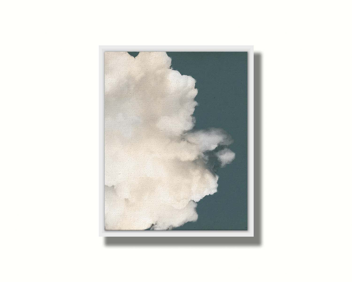 An edited photo of a soft white cloud against a blue background. Printed on canvas in a float frame.