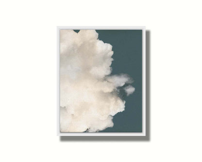 An edited photo of a soft white cloud against a blue background. Printed on canvas in a float frame.