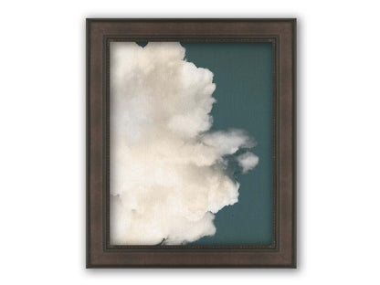 An edited photo of a soft white cloud against a blue background. Printed on canvas and framed.