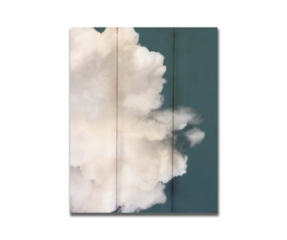 An edited photo of a soft white cloud against a blue background. Printed on a box board.