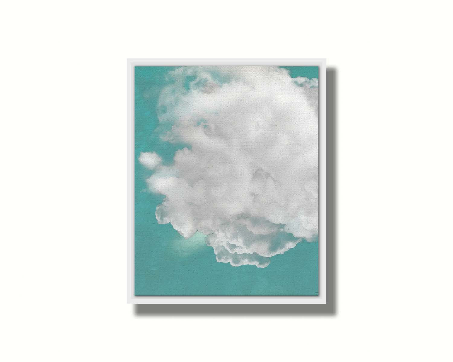 An edited photo of a soft white cloud against a turquoise blue background. Printed on canvas in a float frame.