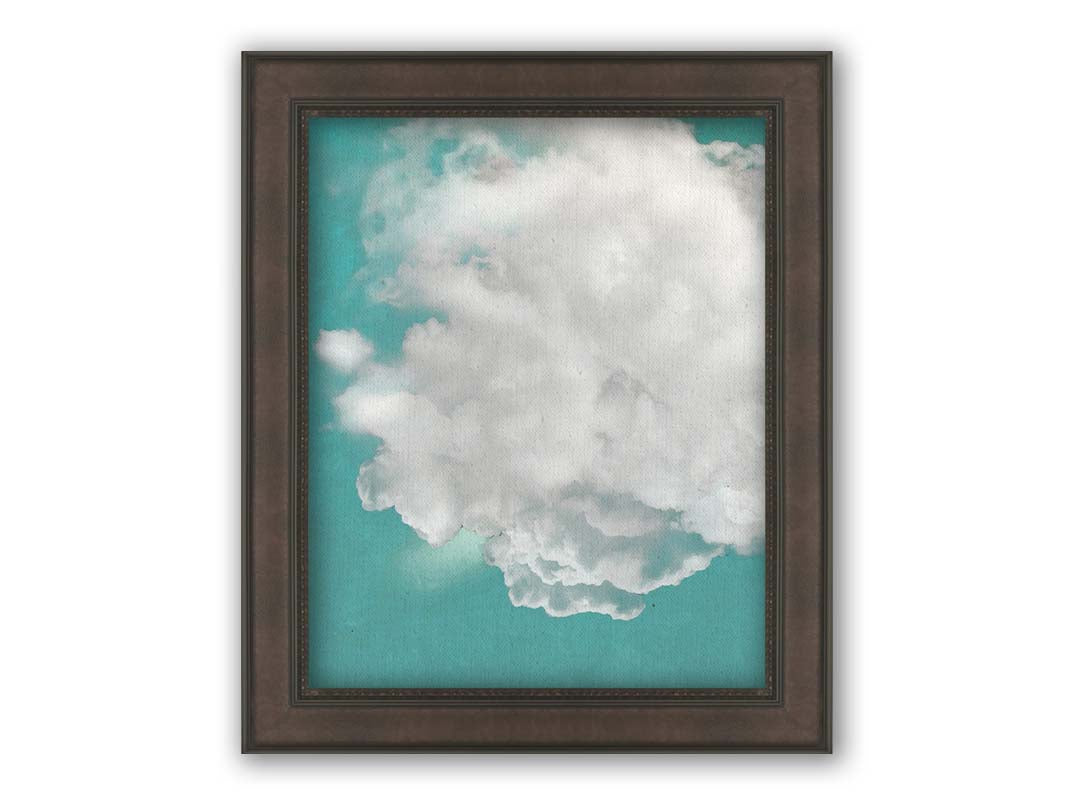 An edited photo of a soft white cloud against a turquoise blue background. Printed on canvas and framed.