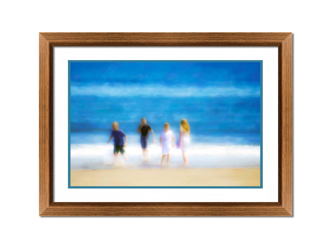 A photograph of four children walking on the beach by the water's edge. It is edited with an effect that gives it a painterly, dreamlike quality. Printed on paper, matted, and framed.