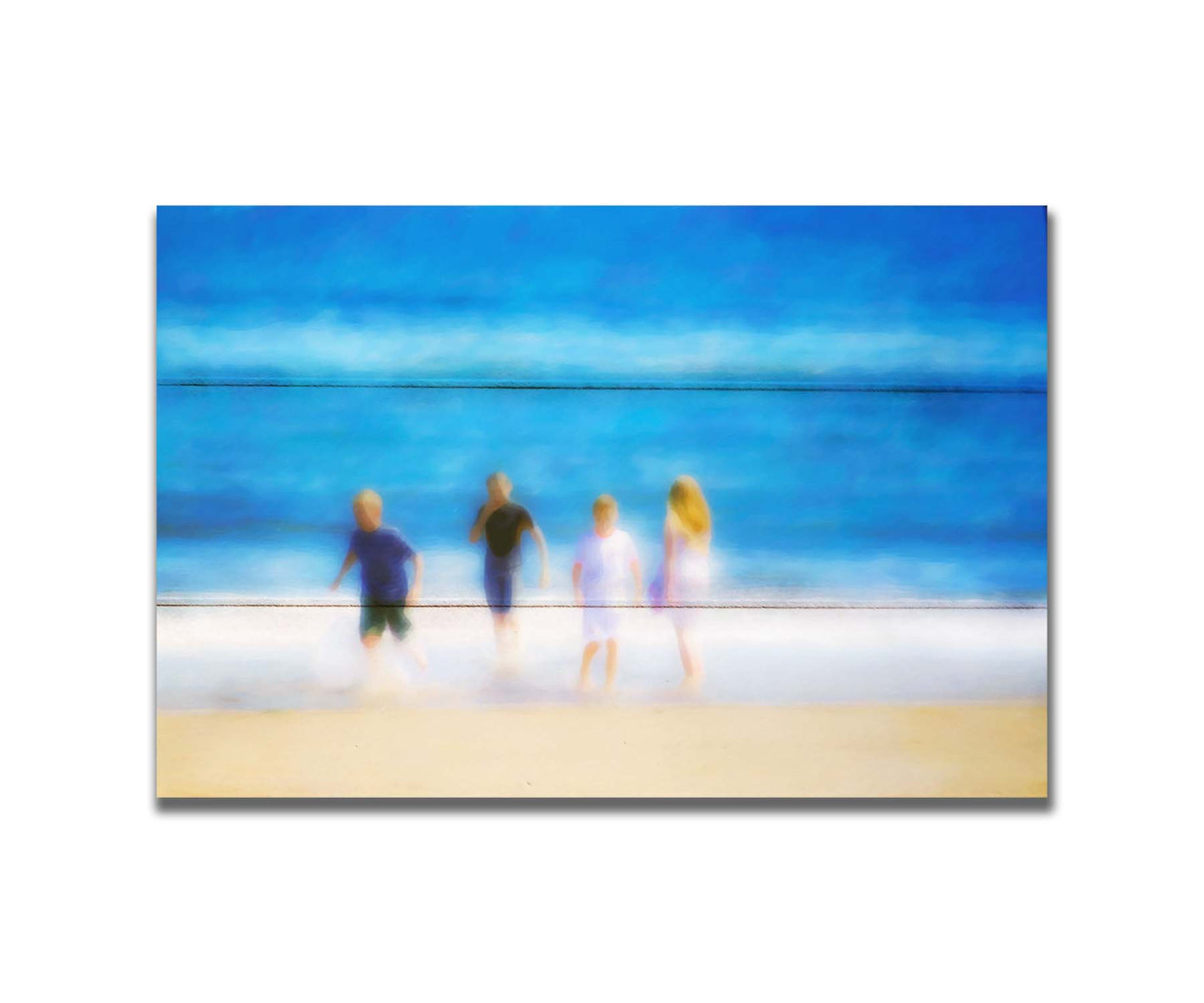 A photograph of four children walking on the beach by the water's edge. It is edited with an effect that gives it a painterly, dreamlike quality. Printed on a box board.