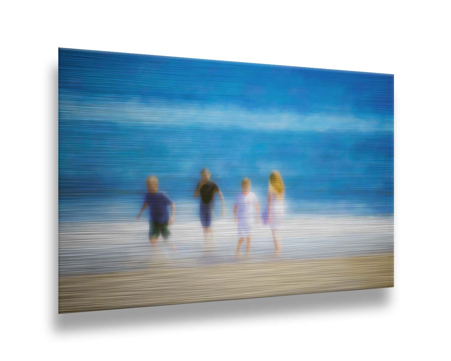 A photograph of four children walking on the beach by the water's edge. It is edited with an effect that gives it a painterly, dreamlike quality. Printed on metal.