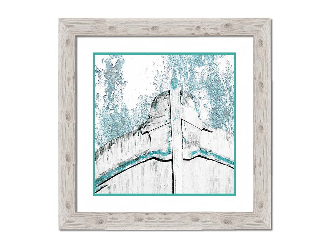 A photograph of an old boat bow in a white and turquoise palette. Printed on paper, matted, and framed.