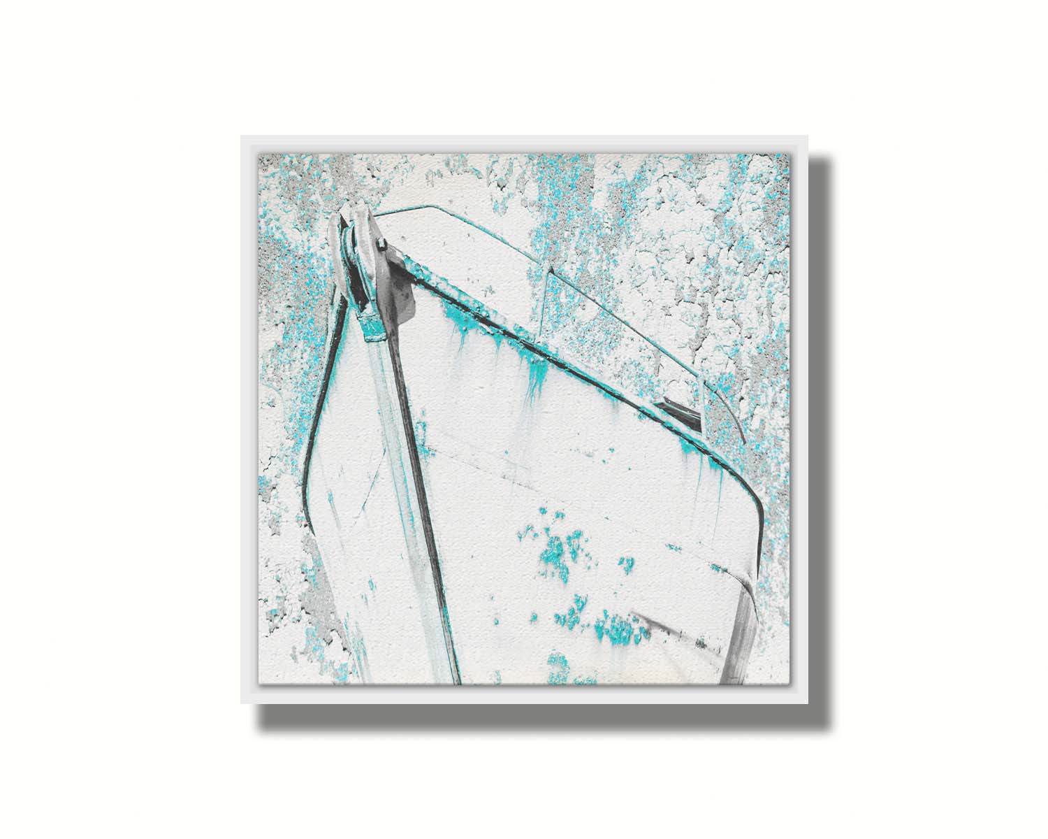 A photograph of an old boat in a white and turquoise palette. Printed on canvas in a float frame.