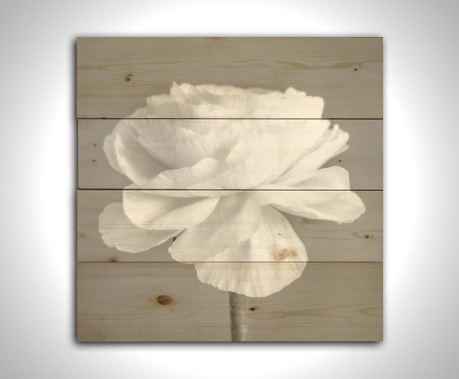 A square grayscale photograph of a light flower. Printed on a wood pallet.