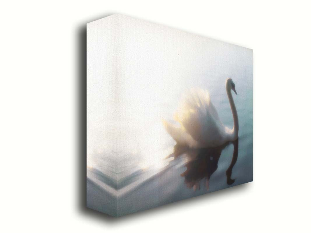 A photograph of a swan swimming across the water. Sunlight reflects strongly on the surrounding water, creating a glow. The photo is edited with a painterly appearance. Printed on canvas.