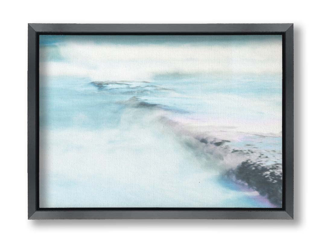 A photograph of a battered jetty being washed over by incoming waves in a cool, white and blue palette. Printed on canvas and framed.