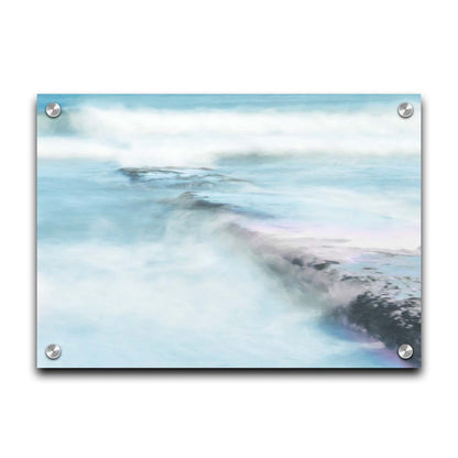 A photograph of a battered jetty being washed over by incoming waves in a cool, white and blue palette. Printed on acrylic.