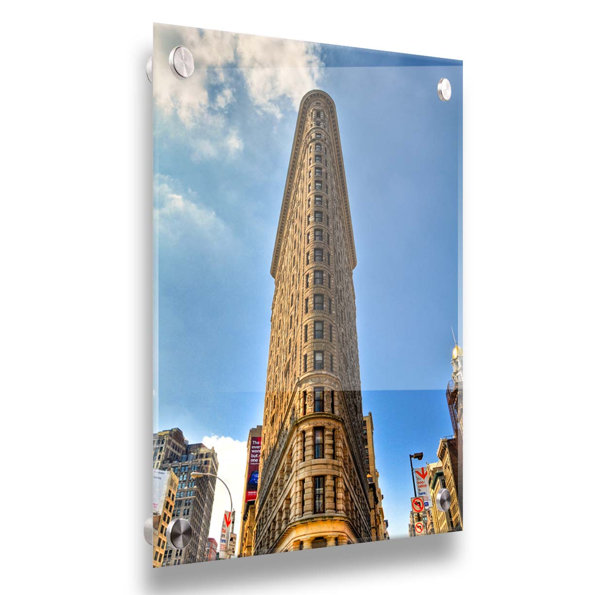 A photo of the Flatiron Building in New York City, New York. Its iconic triangular shape is captures against a bright blue sky. Printed on acrylic.