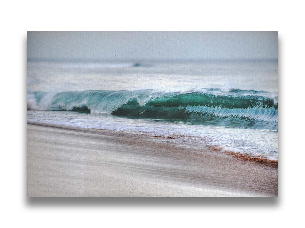 A photo closeup of a wave at Kaʻanapali, the gentle morning light shining through the water to create a beautiful blue-green. Printed on canvas.