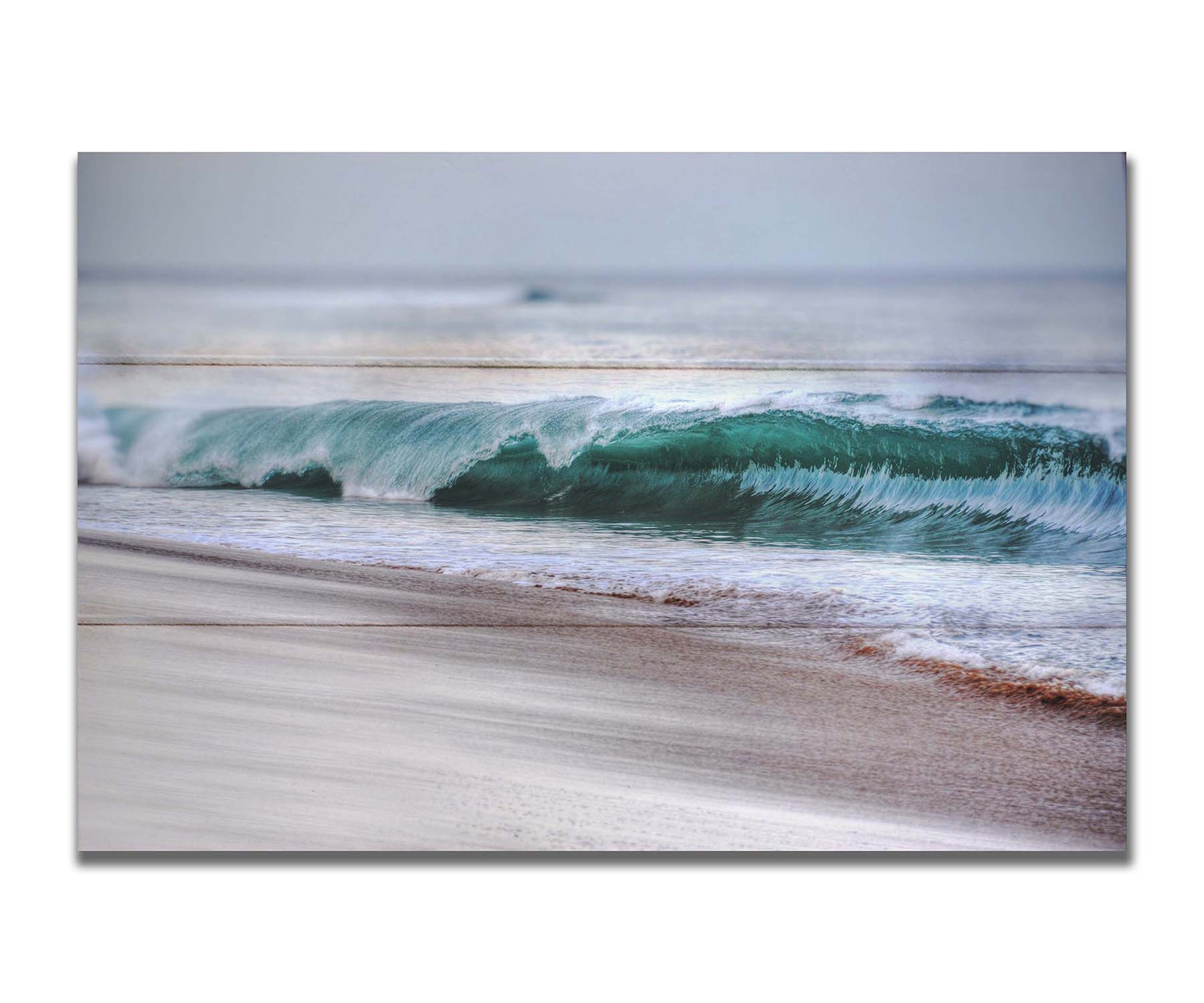 A photo closeup of a wave at Kaʻanapali, the gentle morning light shining through the water to create a beautiful blue-green. Printed on a box board.