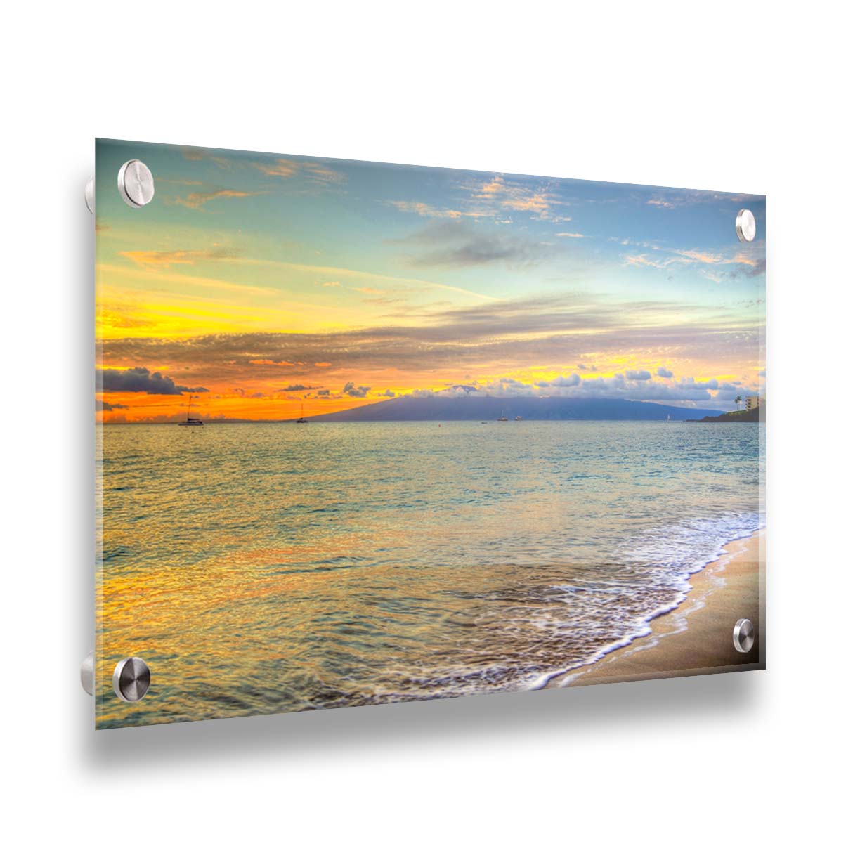 A photo of the sunset on the beach at Kaʻanapali, looking out to sea. Sailboats can be seen on the water, and mountains stand tall among clouds in the background. Printed on acrylic.