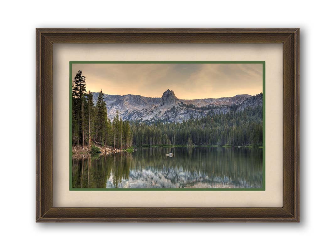 A photo overlooking Lake Mamie, one of the Mammoth Lakes at Mammoth Mountain in California. Printed on paper, matted, and framed.