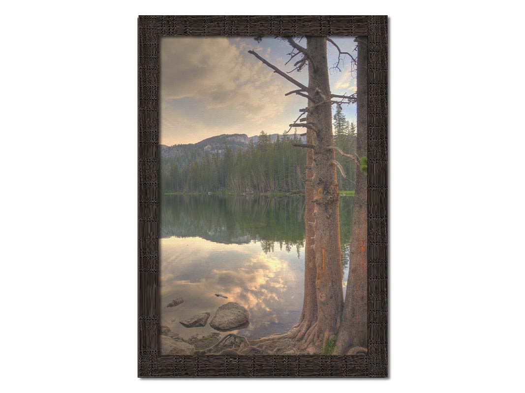 A photo overlooking Lake Mamie at Mammoth Mountain, California. The lake is surrounded by a forest of trees, with the mountains in the background. Printed on canvas and framed.