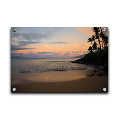 A photo looking out to sea at Maui during sunrise. A surfer can be seen on the water in the distance. Printed on acrylic.