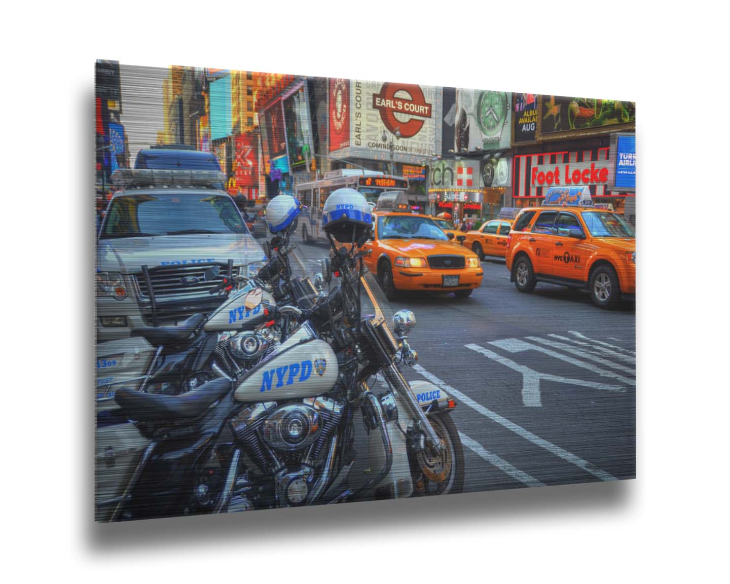 A photo of a street in New York City, featuring several bright orange taxis and New York Police Department vehicles. Printed on metal.