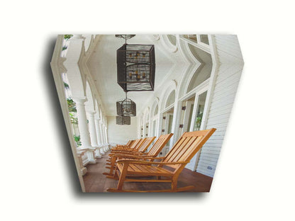 A photo looking down a row of rocking chairs on a porch in O'ahu, Hawaiʻi. Printed on canvas.