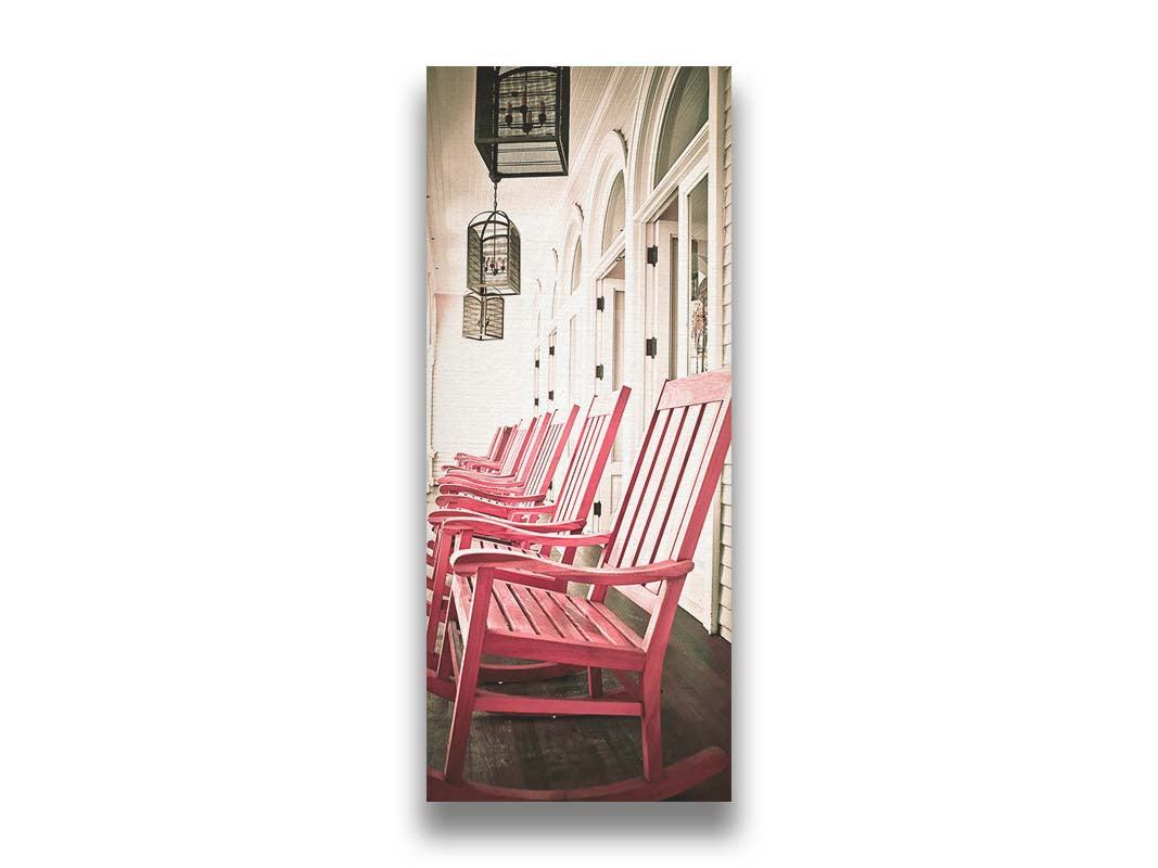 A photo looking down a row of rocking chairs on a porch in O'ahu, Hawaiʻi. Printed on canvas.