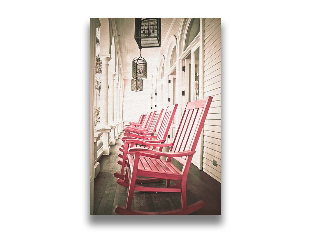 A photo looking down a row of rocking chairs on a porch in O'ahu, Hawaiʻi. Printed on canvas.