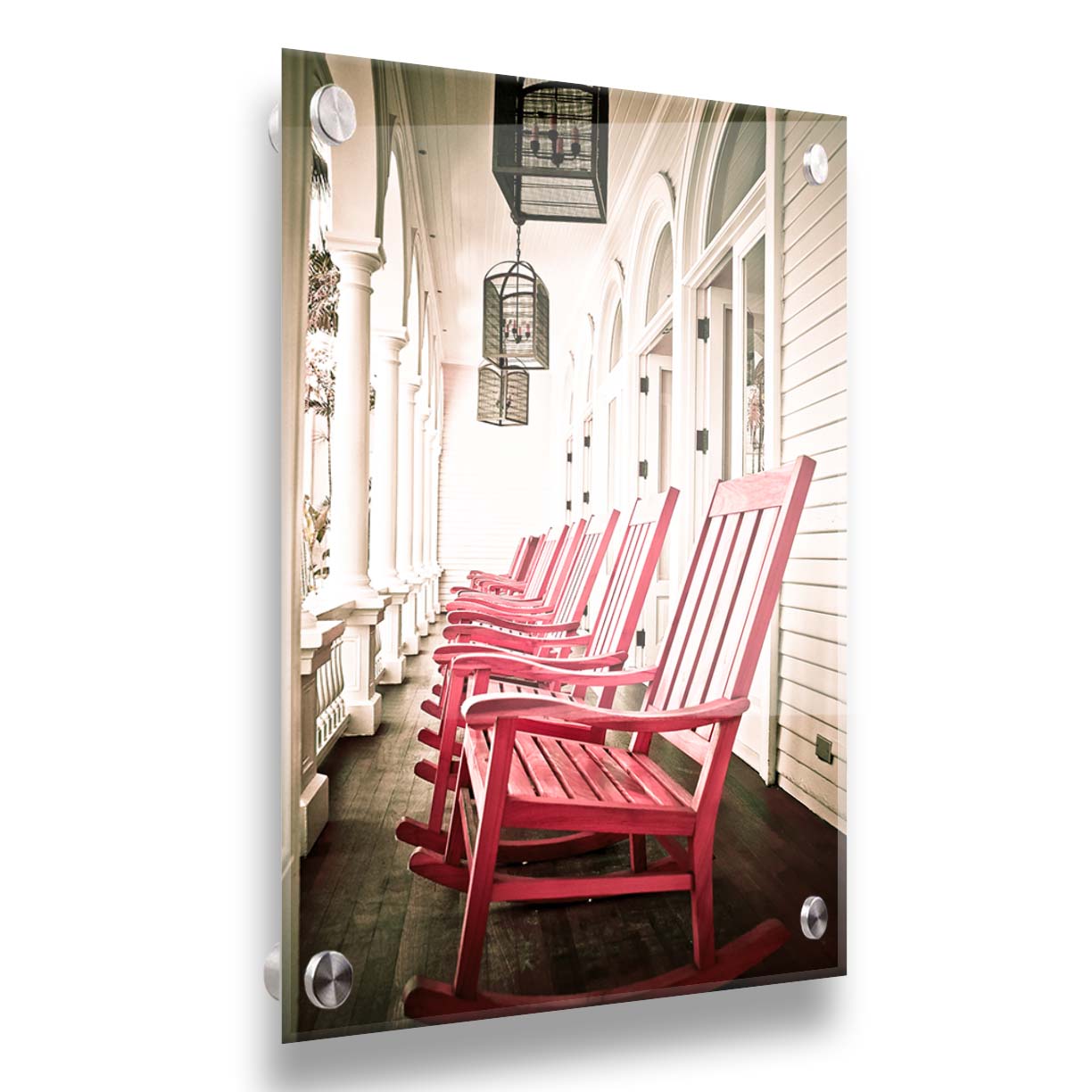 A photo looking down a row of rocking chairs on a porch in O'ahu, Hawaiʻi. Printed on acrylic.