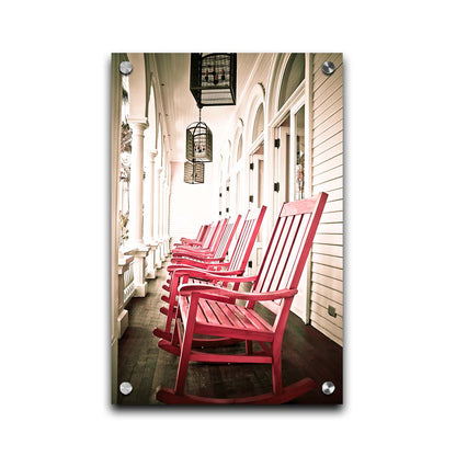 A photo looking down a row of rocking chairs on a porch in O'ahu, Hawaiʻi. Printed on acrylic.