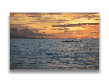 A photo of an outrigger canoe silhouetted on the sea by an orange sunset off the coat of Hawaiʻi. Printed on canvas.