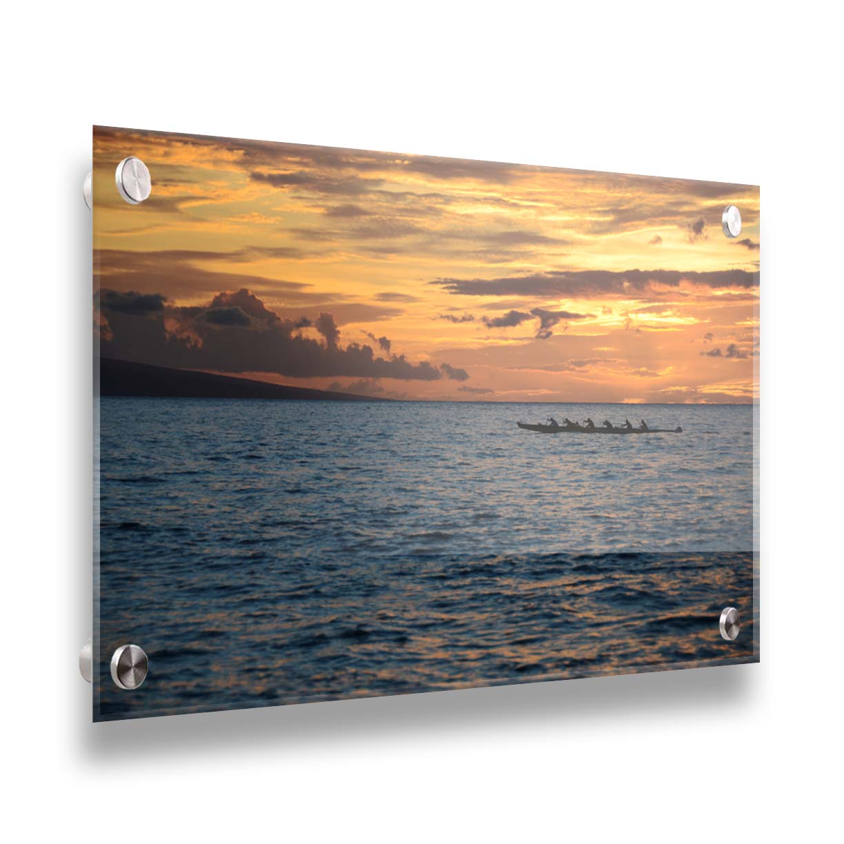 A photo of an outrigger canoe silhouetted on the sea by an orange sunset off the coat of Hawaiʻi. Printed on acrylic.