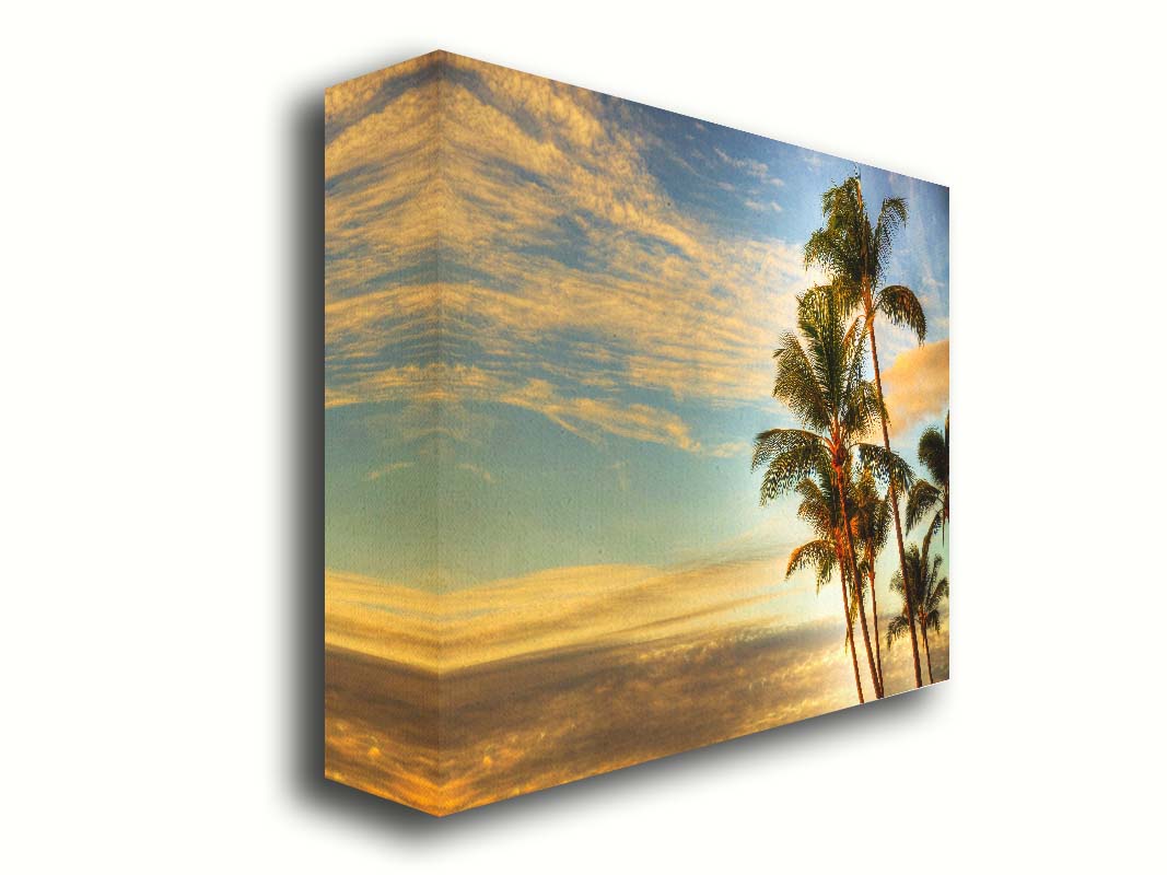 Photograph of palm trees set against the morning sky by the orange hues of the sunrise. Printed on canvas.