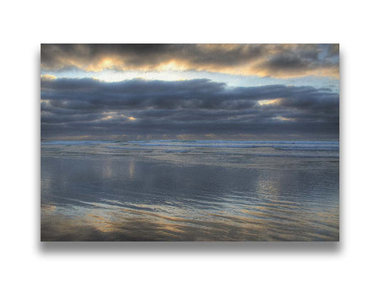 A photo of the sea at La Jolla as viewed near the Ellen Browning Scripps Memorial Research Pier. Rays of light can be seen shining down onto the sea from the cloudy sky. Printed on canvas.