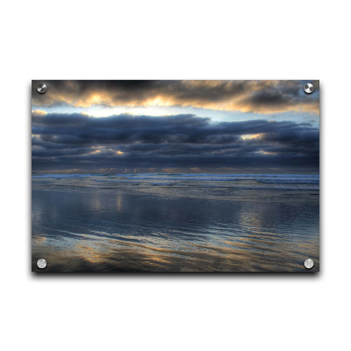 A photo of the sea at La Jolla as viewed near the Ellen Browning Scripps Memorial Research Pier. Rays of light can be seen shining down onto the sea from the cloudy sky. Printed on acrylic.