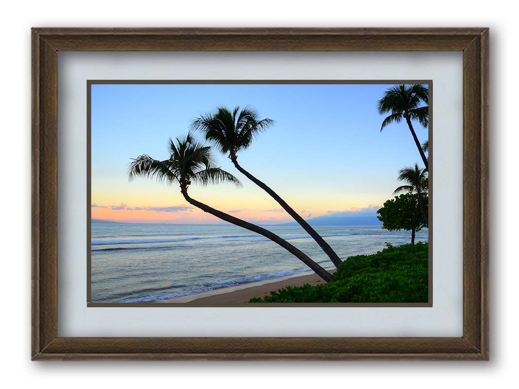 A photo of palm trees silhouetted against the sunrise sky of Hawaiʻi. Printed on paper, matted, and framed.