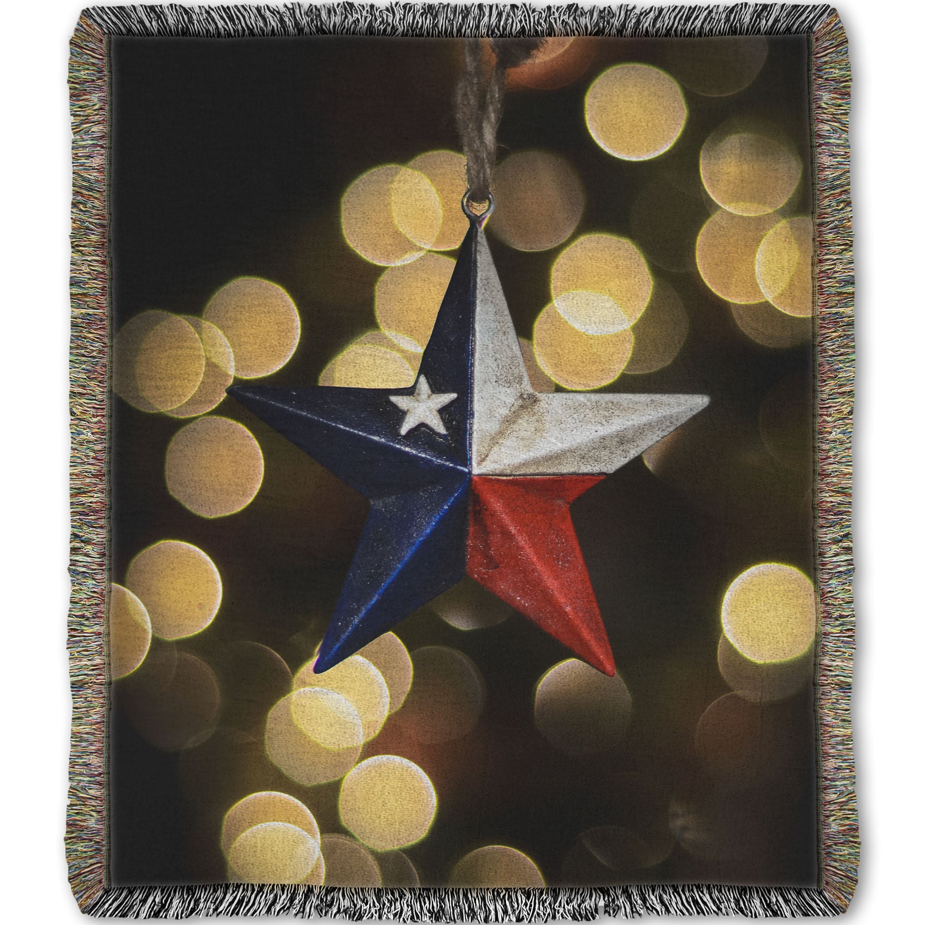 A woven throw blanket printed with the image of a star-shaped texas flag christmas ornament.