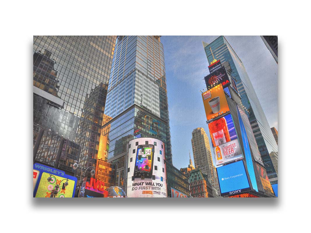 A photo looking up at the buildings and advertisements of Times Square in New York. Printed on canvas.