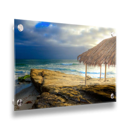 A photo of the palapa at Windansea beach, sitting on a rock in  the fading sunshine. Printed on acrylic.