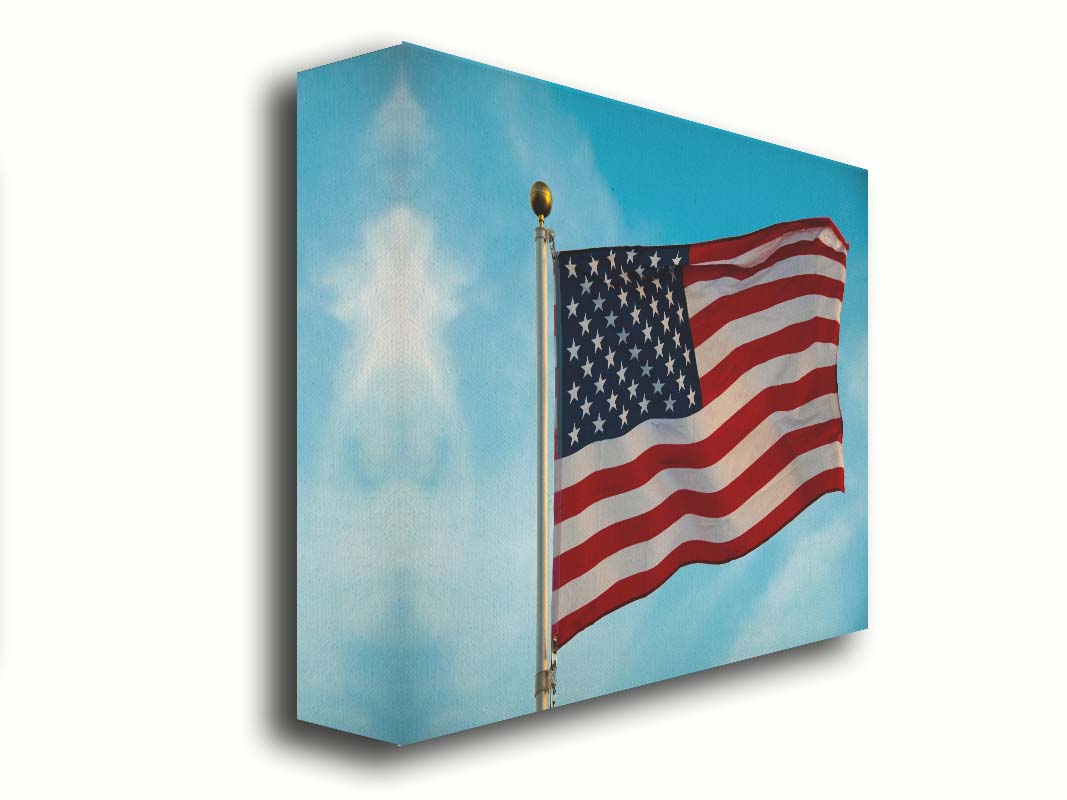 A photo of an American flag agsinst a bright blue sky. Printed on canvas.