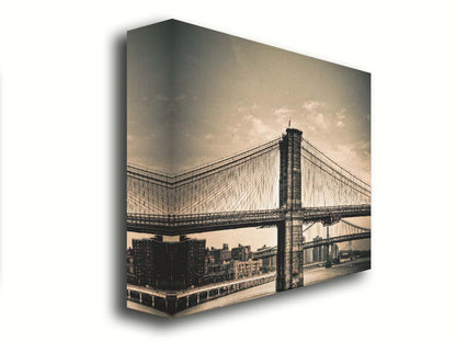 A sepia photo of the brooklyn bridge from the side, accented with a dark vignette. Printed on canvas.