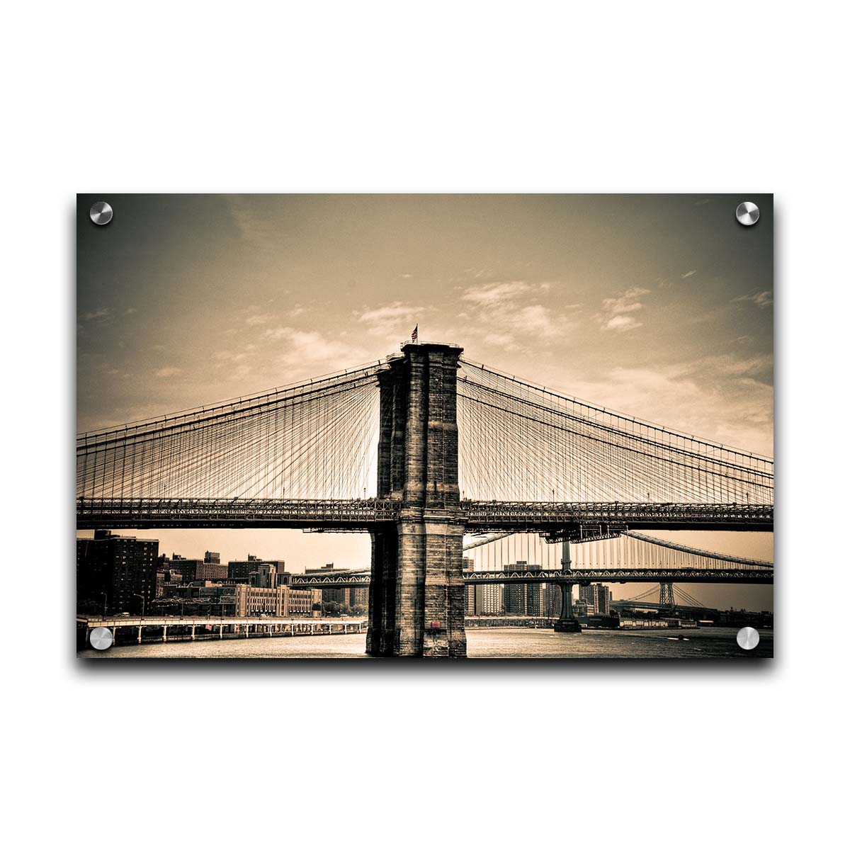 A sepia photo of the brooklyn bridge from the side, accented with a dark vignette. Printed on acrylic.