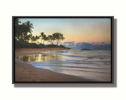 A photo of Keawakapu Beach at sunrise, with palms and mountains in the distance. Printed on canvas in a float frame.