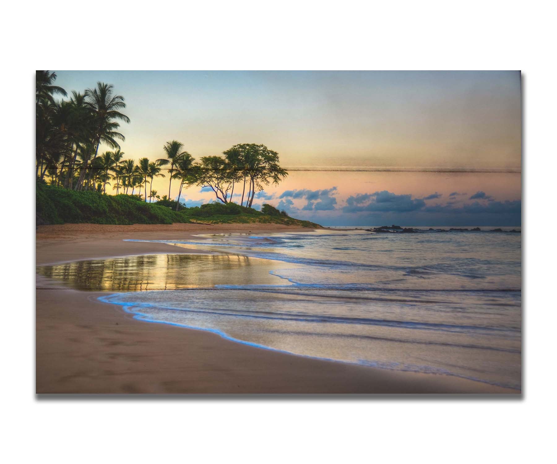 A photo of Keawakapu Beach at sunrise, with palms and mountains in the distance. Printed on a box board.