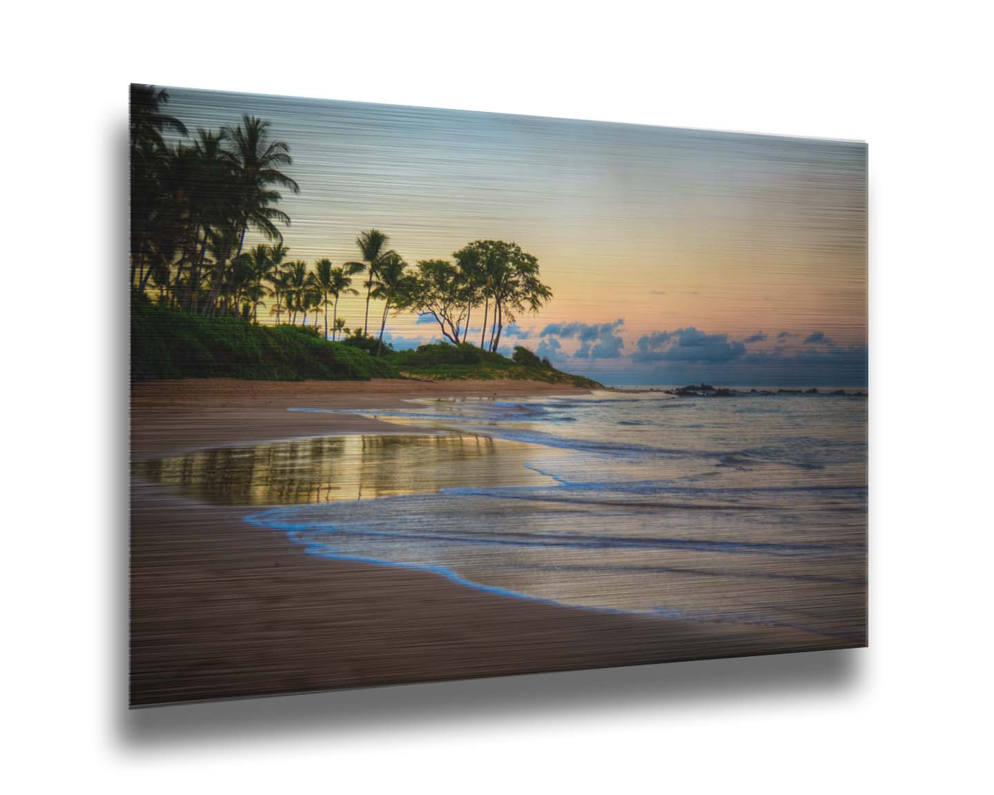 A photo of Keawakapu Beach at sunrise, with palms and mountains in the distance. Printed on metal.