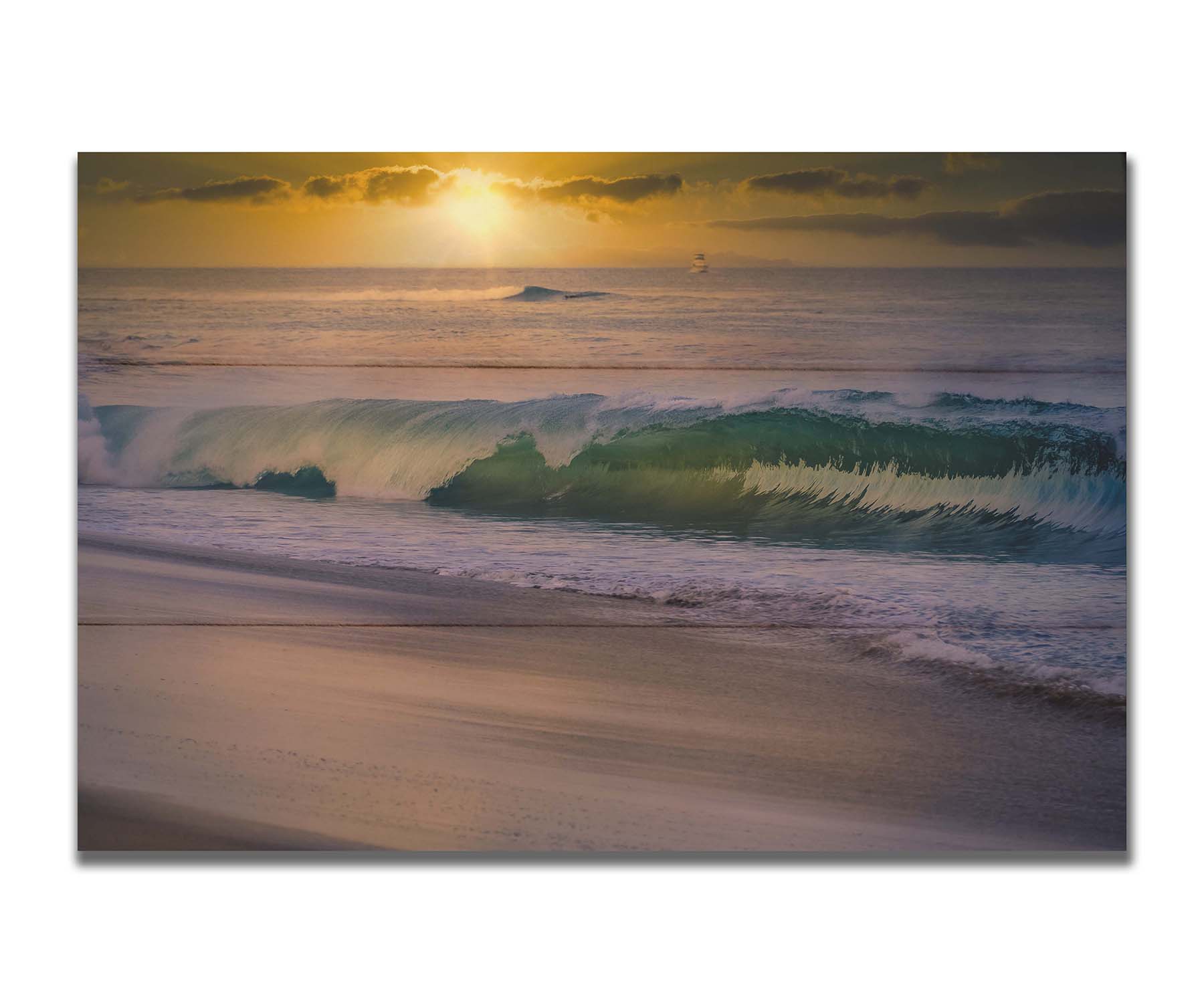 A photo of a calm sea wave rolling onto the beach on Maui at sunset. A boat can be seen on the water in the distance. Printed on a box board.