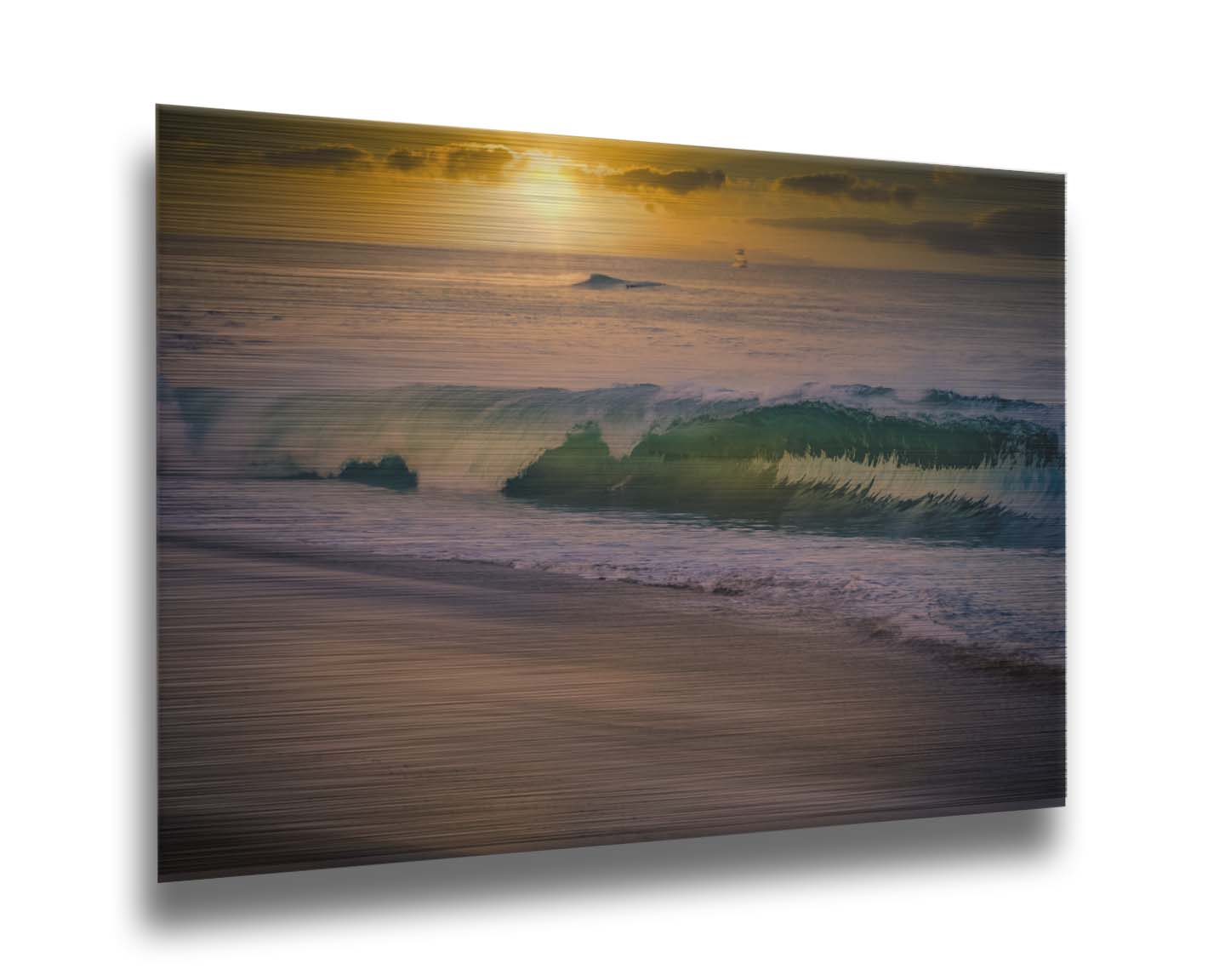 A photo of a calm sea wave rolling onto the beach on Maui at sunset. A boat can be seen on the water in the distance. Printed on metal.