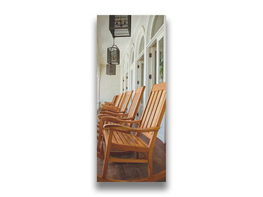 A photo looking down a row of rocking chairs on a porch in O'ahu, Hawaiʻi. Printed on canvas.